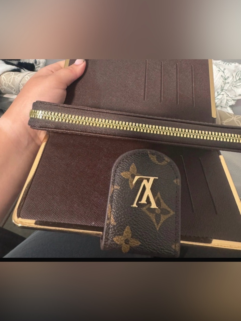 Chic wristlet wallet with shiny hardware baring most fabulous iconic logo😘
